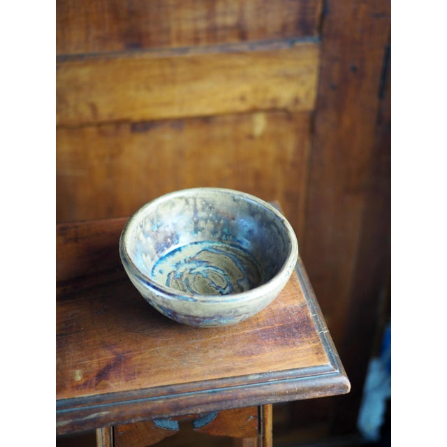 Heavy tenmoku glaze tea cup or bowl in shades of brown, blue and gold. Michel Le Gentil is a Breton ceramist born in 1949...