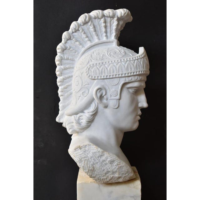 A striking hand-carved solid marble bust of Achilles, the legendary Greek hero of the Trojan War, embodying strength,...