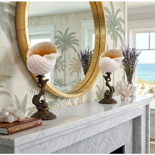Offering a rare pair of vintage seashell and koi fish sculptures, circa Mid 20th Century. These gorgeous seashell...