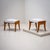 Pair of stools raised on four slightly curved legs with frames in ash. The seats have been newly upholstered in grey...