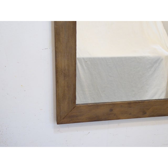 This weathered wood mirror measures 36.25"H x 30.25"W.