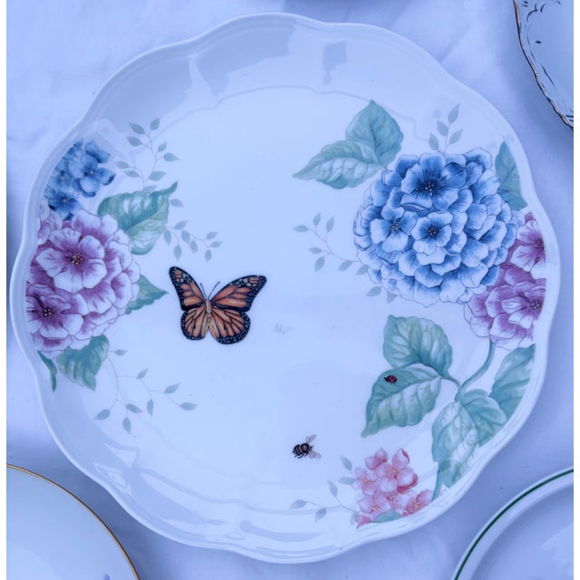Hand painted hydrangeas, roses, and other garden flowers in lovely pinks, blues, and yellows create a virtual garden for...