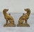 Antique bronze andirons, originating from France in the 1930s. They are crafted in the shape of seated dogs, very...