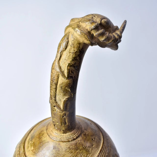 This striking metal pot from the Bobo people of Burkina Faso showcases both sculptural imagination and refined...