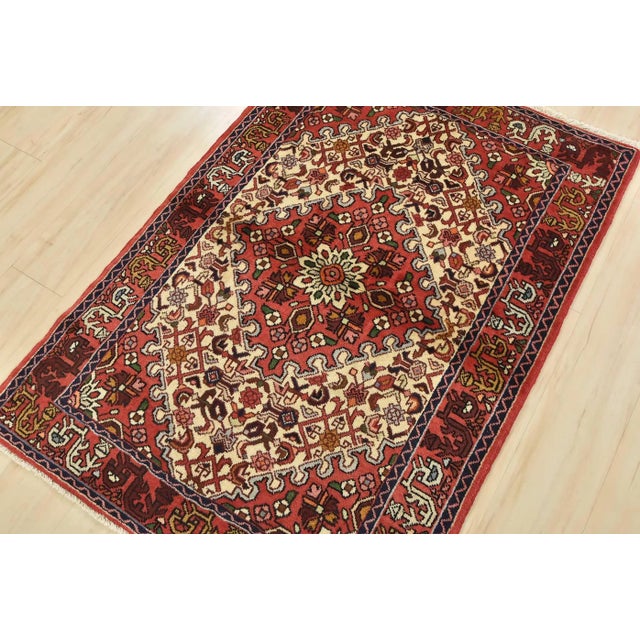 This authentic vintage tribal Hamedan rug is hand-knotted with fine wool and natural dyes. This nomadic oriental rug...