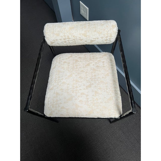 This exquisite stool is perfectly poised, perched on delicate legs that are as faint as an insect’s. The natural iron body...