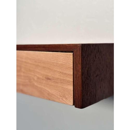 A minimalist-style floating vintage chest of drawers from the 1960s, designed for wall mounting. Perfect as a nightstand...