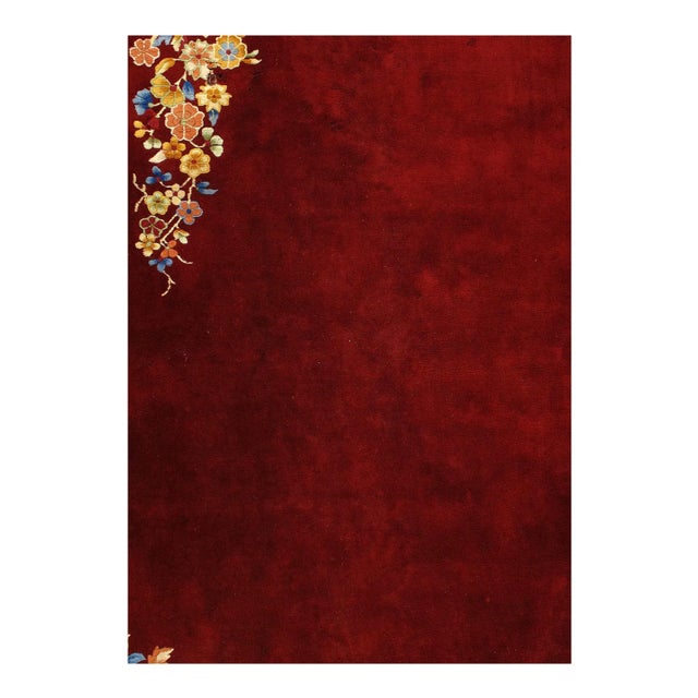 Beautiful antique Chinese Art Deco hand knotted wool rug with a red field. This Chinese rug has red color accents in a...