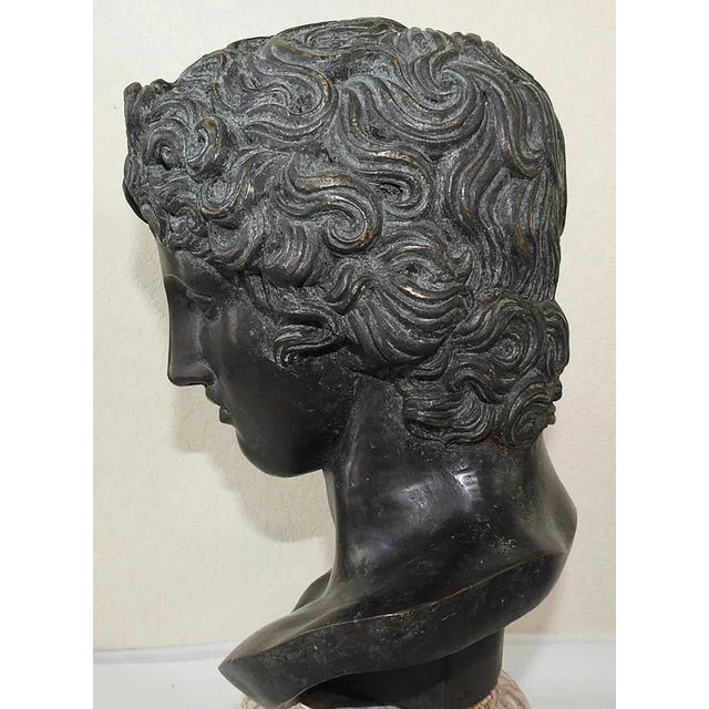 Overview An exceptional, monumental Grand Tour-style patinated bronze portrait bust depicting the famous Benevento Head...