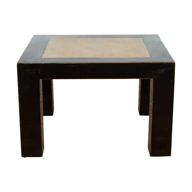 A Chinese vintage square shaped lacquered wood coffee table from the 20th century with antique palace courtyard stone...