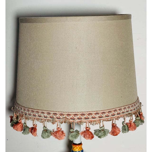 Nice lamp shade in oatmeal linen decorated with tasselated fringes.