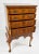 The 7 Drawer Burl Walnut Queen Anne Style Tall Boy Chest on Stand is a stylish and practical addition to any bedroom or...