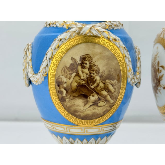 This exquisite pair of 19th-century lidded urns, crafted by the esteemed Königliche Porzellan-Manufaktur (KPM) of Berlin,...