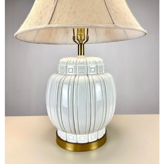 A striking and beautiful mid century modern ceramic design. Circa 1960’s table lamp in natural white with subtle crackle...