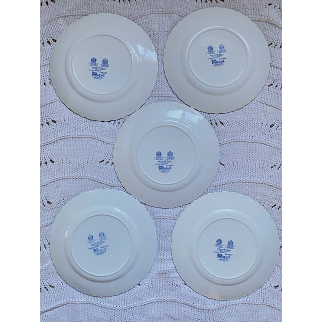 Beautiful vintage Johnson Bros blue ironstone dinner plates featuring classic coaching scenes in rich blue transferware....