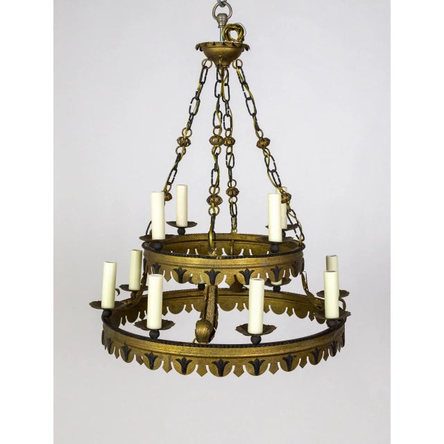 A Mid-Century, Tudor Style, tole chandelier. It has a double ring structure- with 4 lights on the top and 8 on the bottom-...