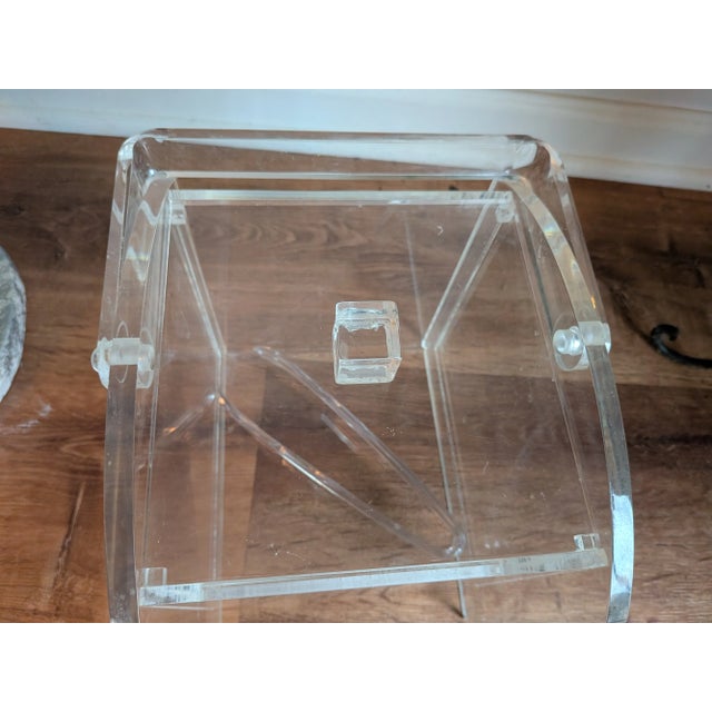 Mid-century lucite ice bucket with handle. I believe this is from the 70s