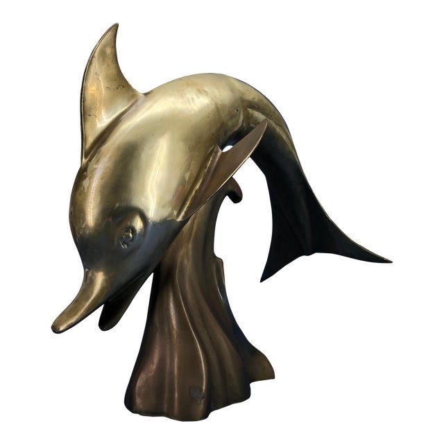Large midcentury brass sculpture of a jumping dolphin.