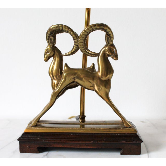 Vintage brass ibex table lamp. I believe someone created this lamp using two brass ibex bookends, making it a one of a...