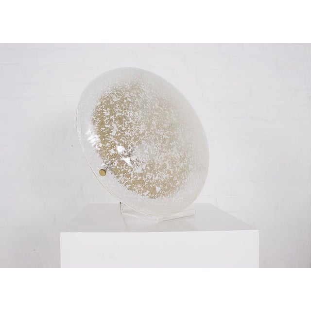 Round chandelier or wall sconce in blown and glittered Murano glass, gold-tone metal and brass, 1970s. Diameter 41.5 cm x...