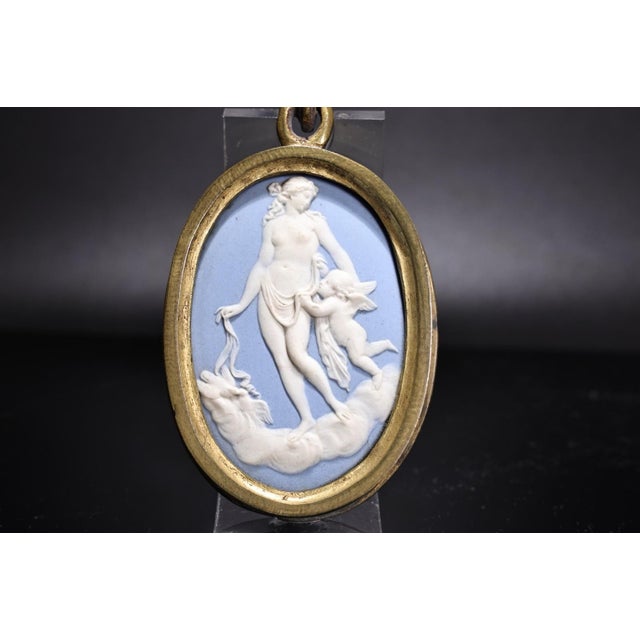 Antique 19th century Wedgwood light blue jasperware oval plaque of Venus and Cupid in a gilt frame. Measures 5 3/4" tall...