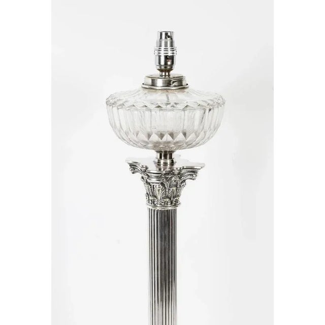 This is a splendid antique Victorian silver-plated Corinthian column oil table lamp now converted to electricity, circa...
