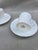 A pair of rare demitasse cups and saucers from the legendary Coalport collection. They have the distinct embossed cabbage...