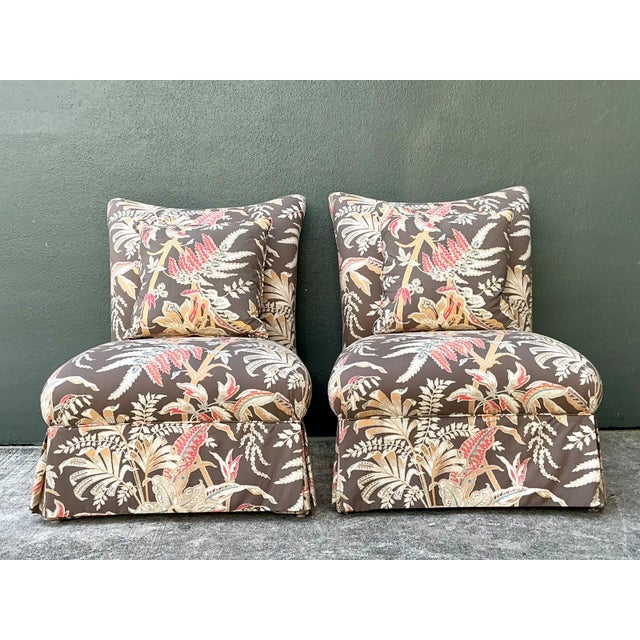 This pair of Brunschwig and Fils slipper chairs showcases the house's celebrated Seychelles cotton print, a botanical...