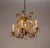 A Maria Theresa style chandelier from the 1950s. It has 5 arms with candle-style lights and a center light. With lovely...