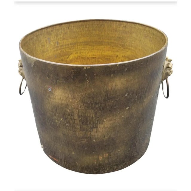 A large antiqued brass classical jardiniere in good vintage condition. Measure 16 inches in width, 13.5 inches in depth...