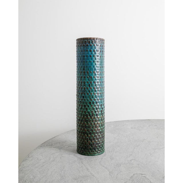 A rare and unique oversized swedish mid century stoneware cylinder vase in a decorative and characteristic turquoise blue...