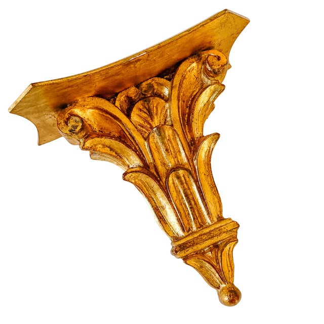 Absolutely gorgeous 1960s vintage Italian Florentine hand-carved giltwood wall bracket shelf made in the very ornate...