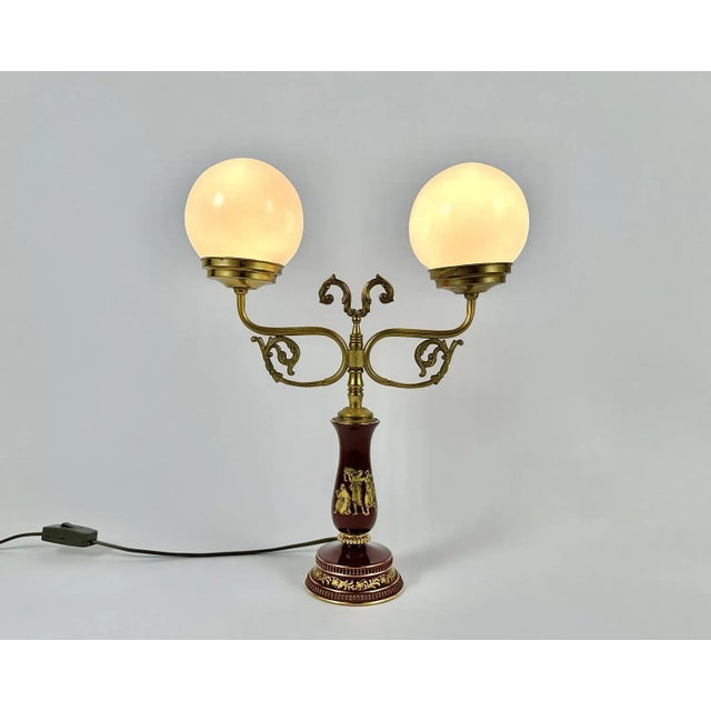 Vintage brass table lamp with two glass shades. This elegant table lamp is a combination of elegance and minimalism. A...