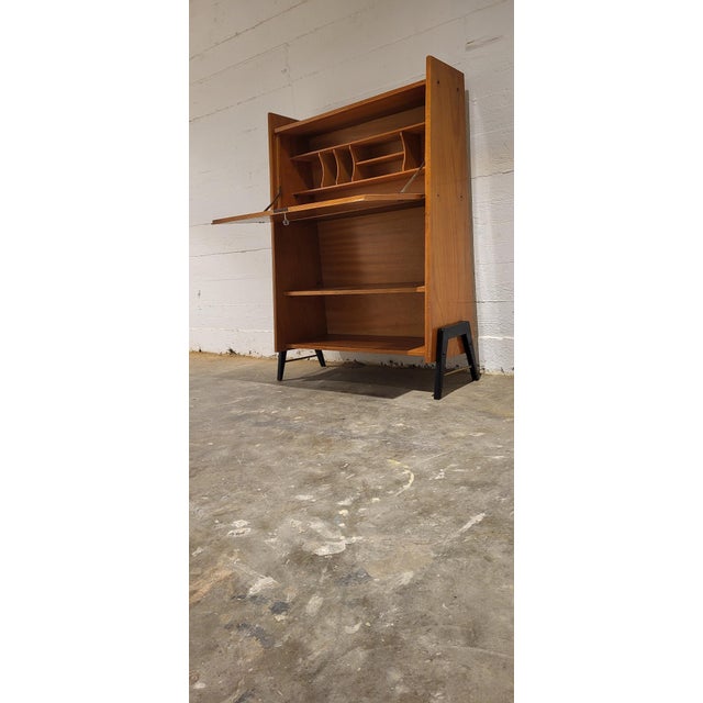 Sweet secretaire from the fifties. Light wood with black and brass feet. Very cute and fit for a small apartment or...