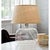 Adding a level of sophistication to any space, this table lamp is crafted of gorgeous seeded glass and topped with a...