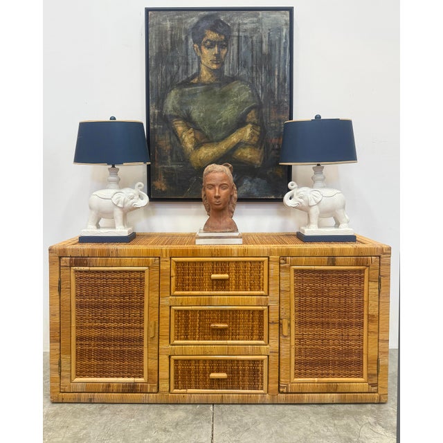 Vintage Coastal Woven and Rattan Wrapped Cabinet With Wood Trim Offered fr sale is a vintage coastal cabinet that is...