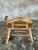 Small brutalist-style bench with backrest and armrests in light Asian teak. Dimensions: Width: 65cm; Total height: 67cm;...