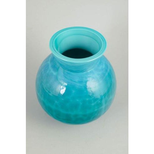 Eva Englund for Pukeberg, art glass vase. Globular vase in turquoise art glass with lively swirling colour movement and a...