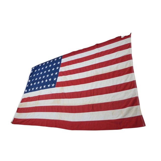 Mid 20th century 48 star United States / American flag. Made of cotton with stitched stripes and stars. Edge features two...