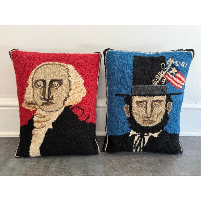 Fun pair of hooked wool pillows featuring George Washington on a red ground and Abraham Lincoln on a blue ground. Folk Art...