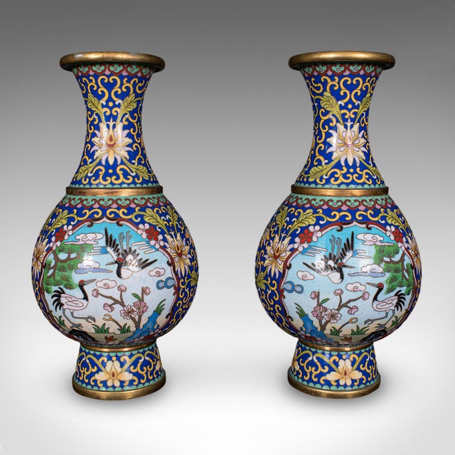 This is a pair of vintage baluster form vases. An Oriental, cloisonné posy urn, dating to the late 20th century, circa...