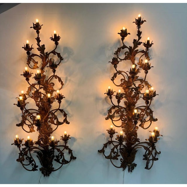 A monumental pair of Venetian gilt iron climbing roses wall sconces comprising of 15 lamps each . Truly outstanding pieces...