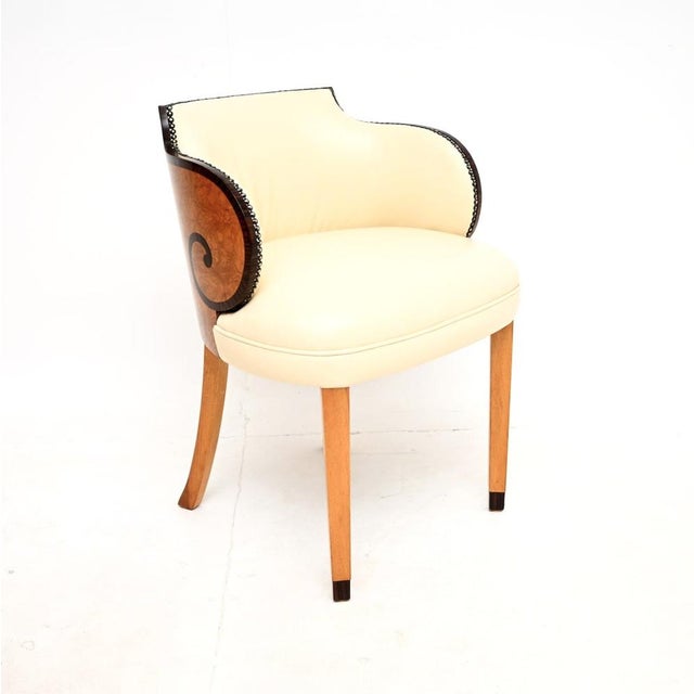 A beautiful and incredibly well made Art Deco burr walnut and leather armchair / desk chair. This was made in England, it...