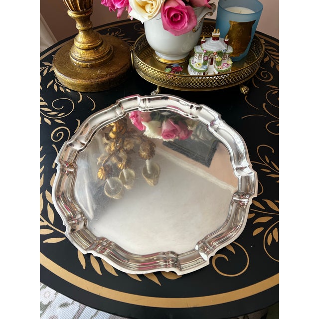 This is a stunning midcentury sterling silver tray by Poole in their "Chippendale" patter. It measures 13 5/8" diameter...