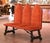 Architectural in form and richly detailed, this antique three-seat bench reflects the bold character of Spanish...