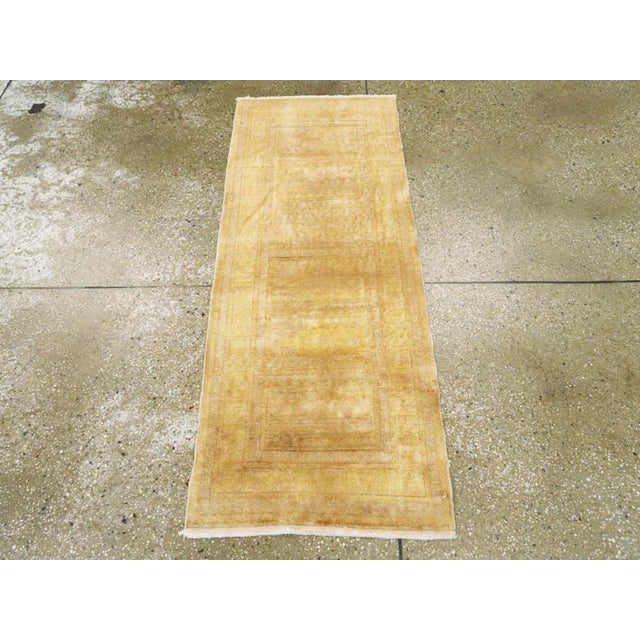 A vintage Turkish Sivas runner. Six rectangular panels, with yellow-gold outlines and beige centers, are the main...