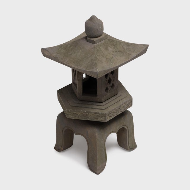 Sculptural lanterns of carved stone or wood are traditionally placed throughout Buddhist temple grounds or courtyard...