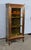 Small all-sided mahogany display case decorated with brass moldings. Indeed, its sides and the door frame are decorated...