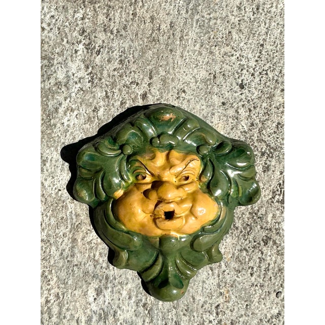 Add a touch of historical charm to your space with this exquisite vintage ceramic wall fountain mask, a captivating piece...