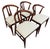 Elevate your dining space with this stylish set of four Mid-Century Modern wishbone-style dining chairs. Crafted with...